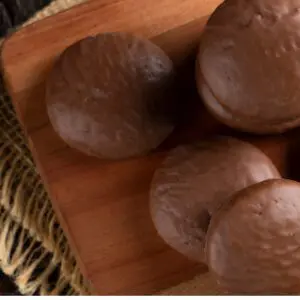 Brazilian Pão de Mel dessert on wooden cutting board display