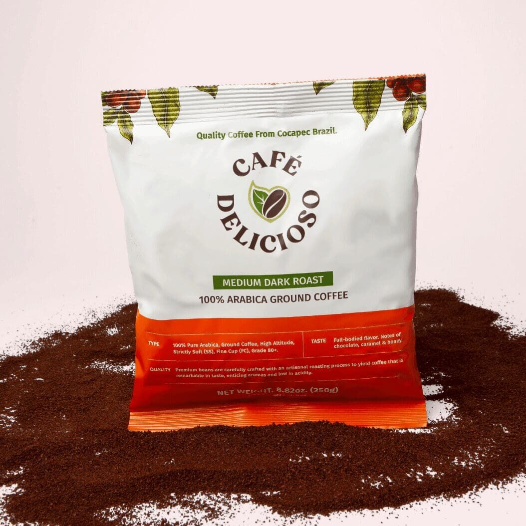 OurCoffee_Bag A bag of coffee sitting on top of some ground coffee.